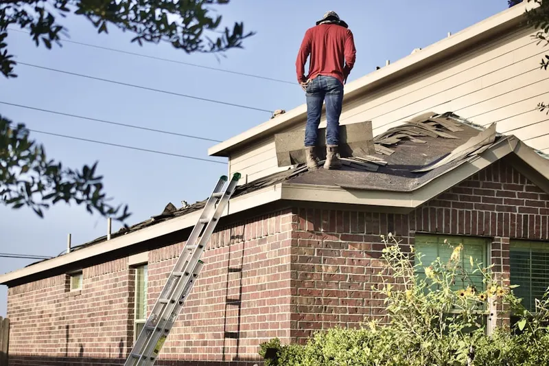 Professional roofer working on a residential roof in Downtown Chamblee